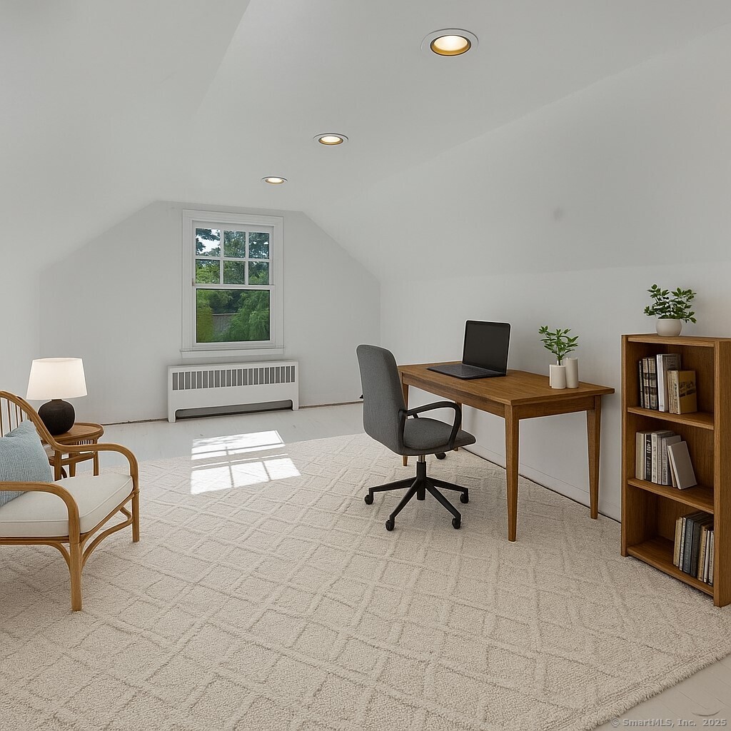 79 Middlesex Avenue Chester, CT 06412 - Photo 15 of 31 a view of a workspace with furniture and a book shelf