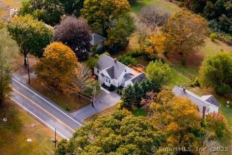 a view of a house with backyard and porch