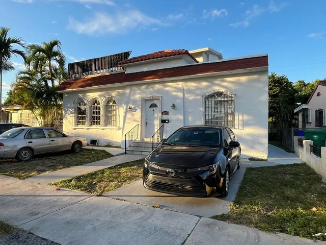 a car parked in front of a house