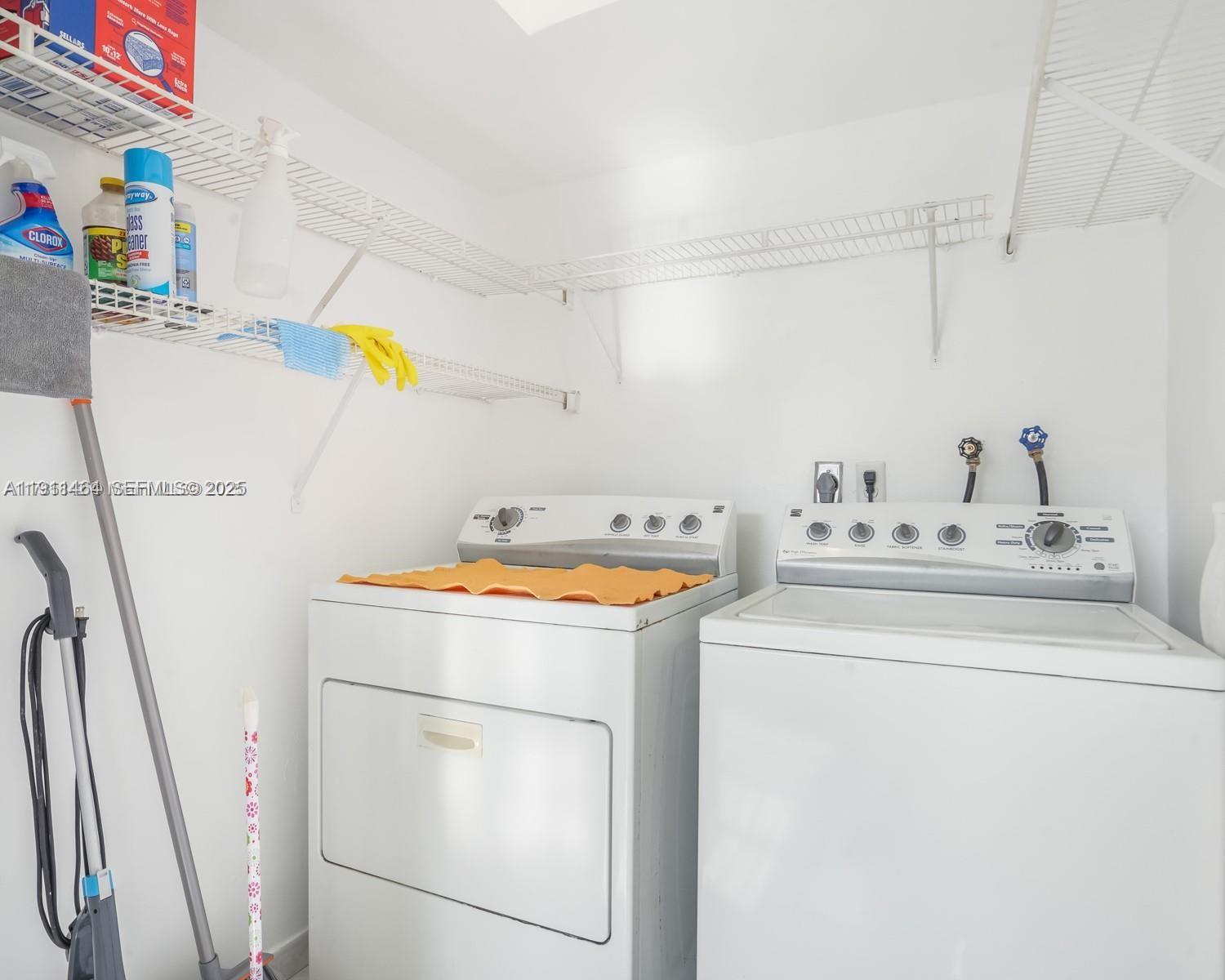 5629 Southwest 7th Street Miami, FL 33144 - Photo 15 of 22 a utility room with dryer and washer