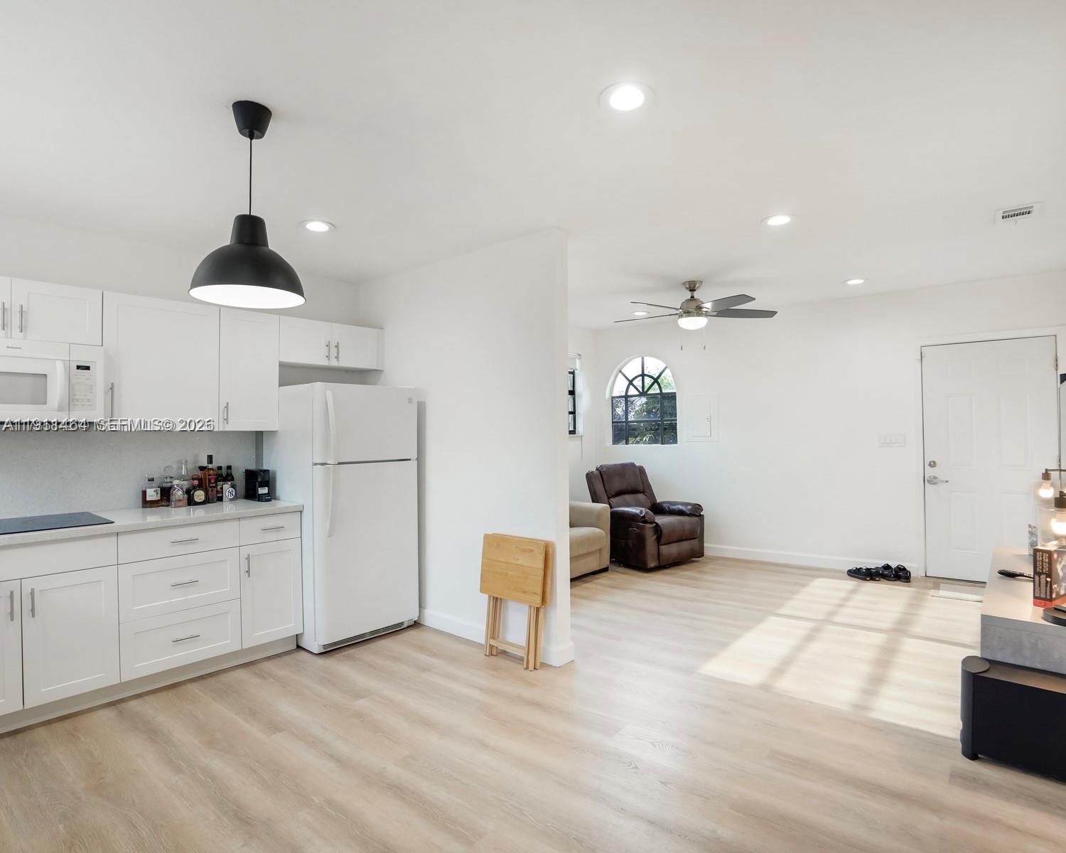 5629 Southwest 7th Street Miami, FL 33144 - Photo 18 of 25 a kitchen with sink and cabinets