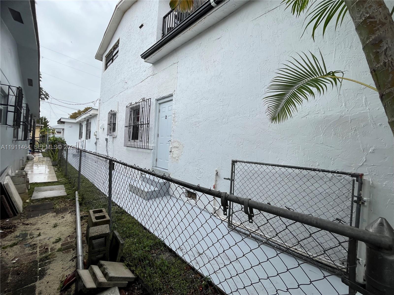 5629 Southwest 7th Street Miami, FL 33144 - Photo 24 of 25 a stair with table and chairs