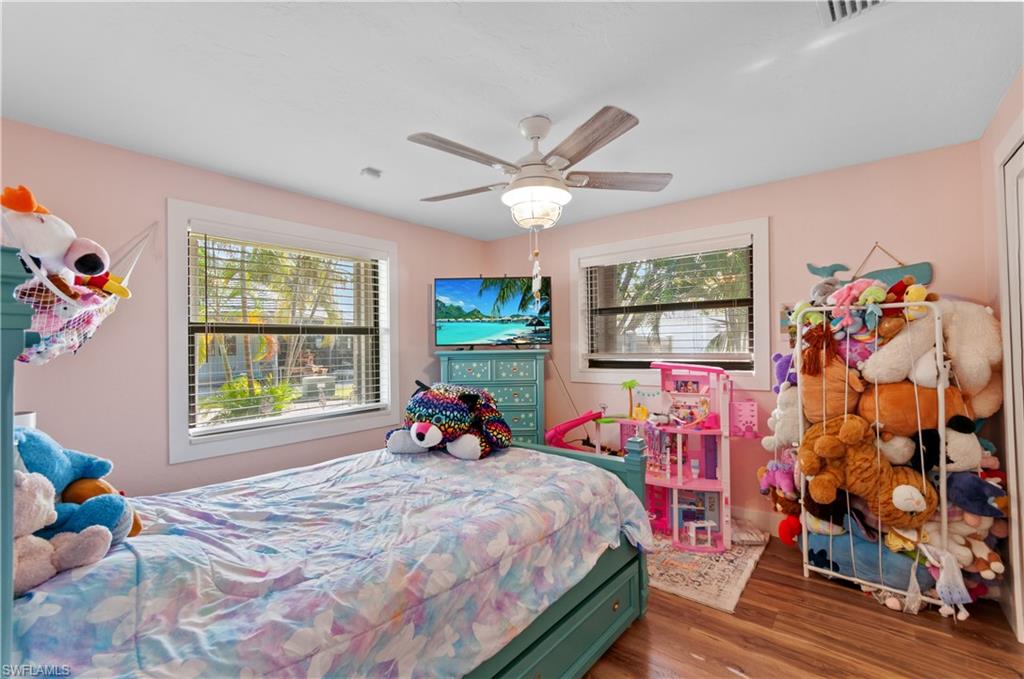 13308 Island Road Fort Myers, FL 33905 - Photo 17 of 39 a bed room with a bed and a window