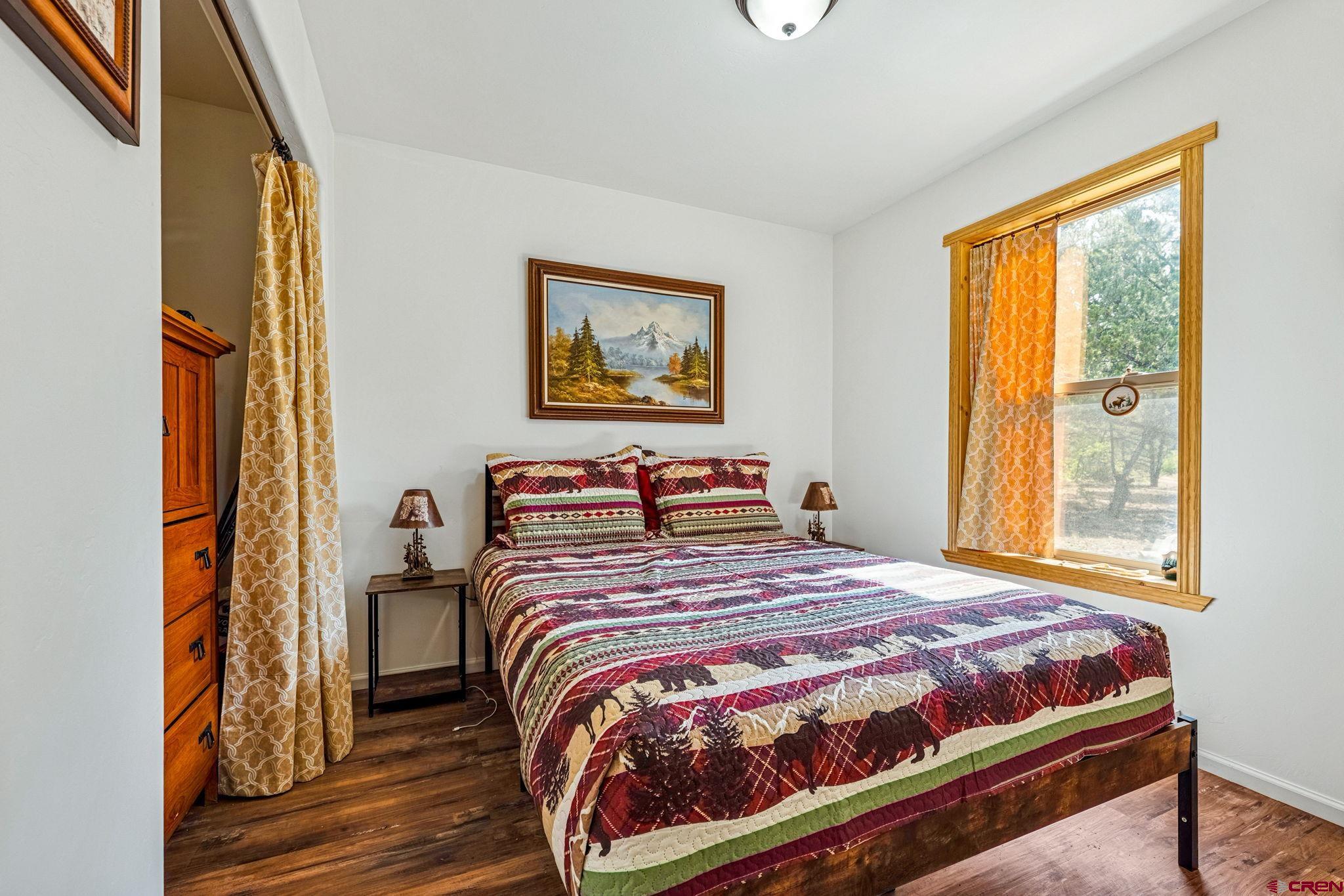 1788 Foxfire Road Bayfield, CO 81122 - Photo 11 of 34 a bedroom with a bed and a window