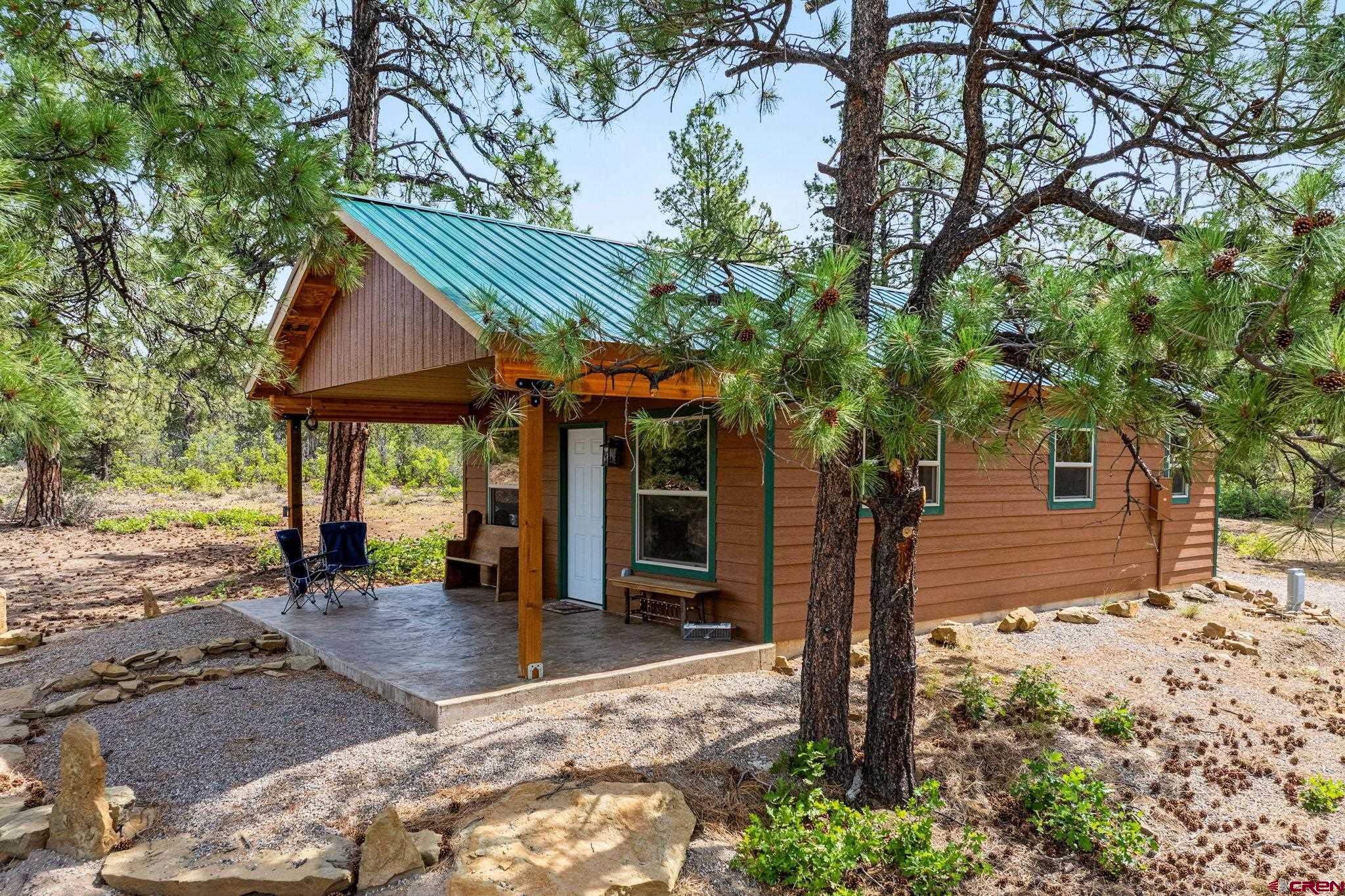 1788 Foxfire Road Bayfield, CO 81122 - Photo 21 of 34 a front view of a house with a tree