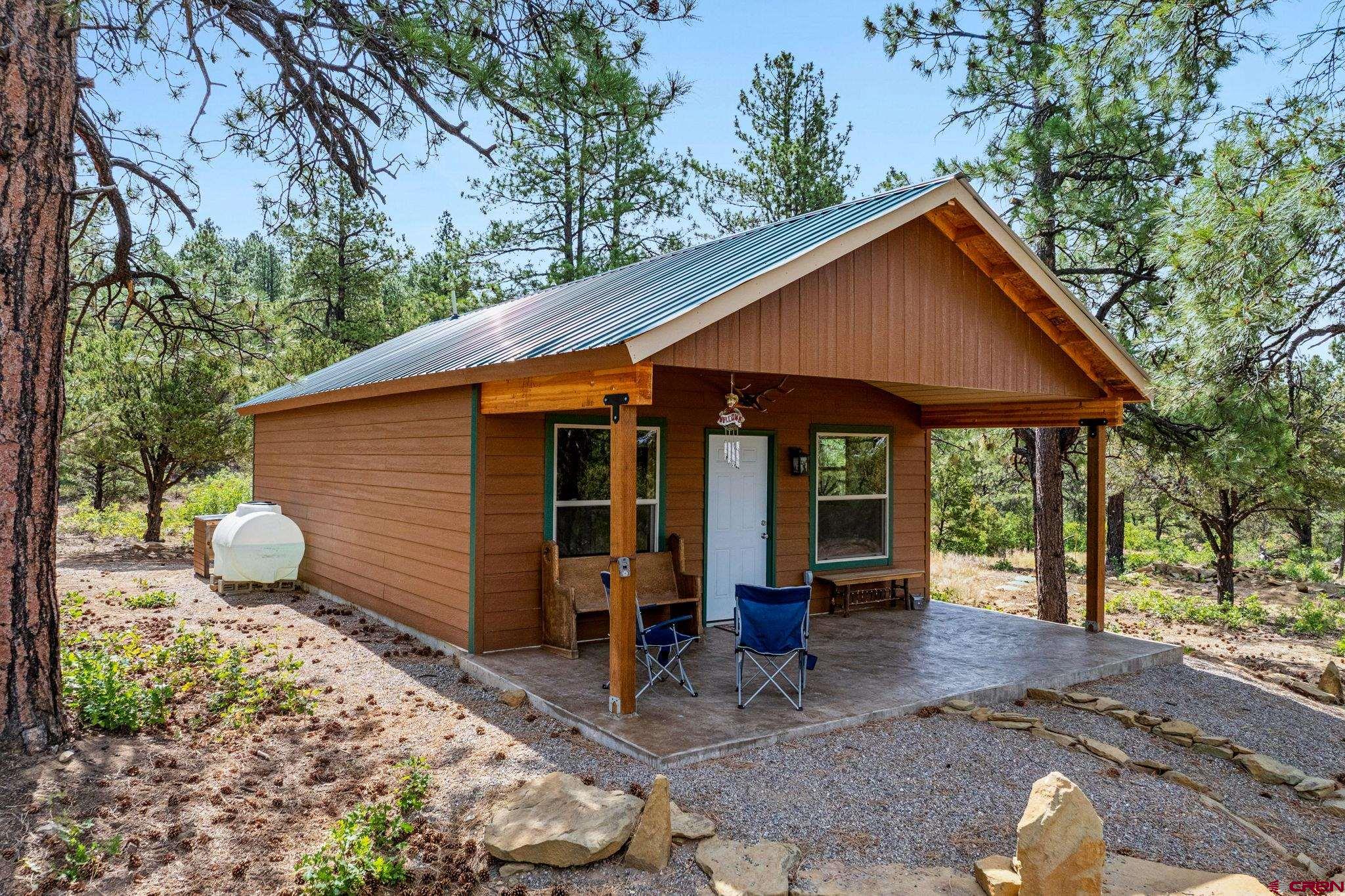 1788 Foxfire Road Bayfield, CO 81122 - Photo 23 of 34 a front view of a house with garden
