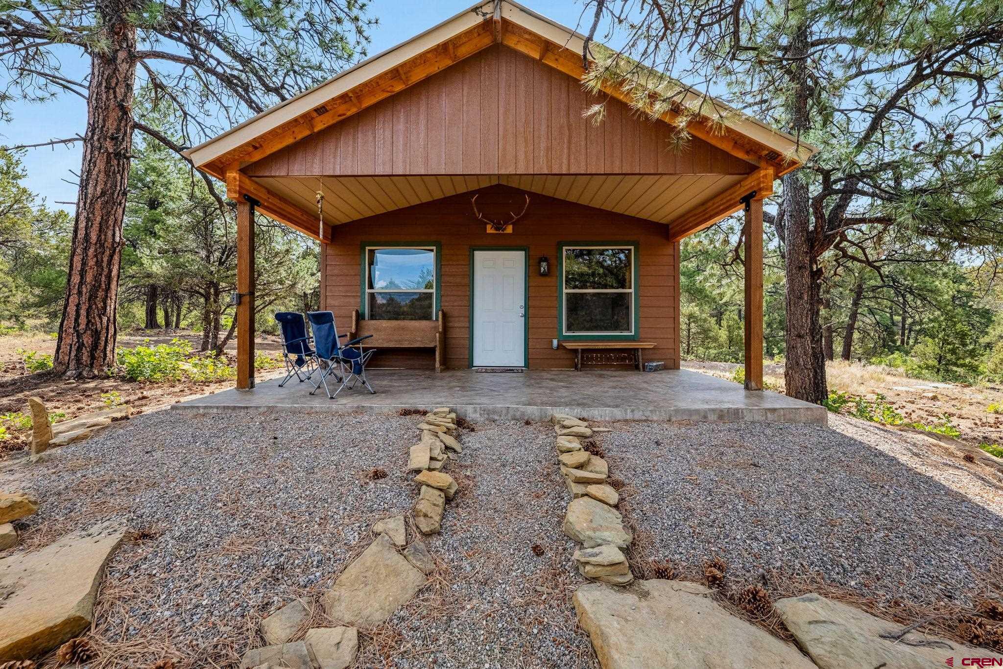 1788 Foxfire Road Bayfield, CO 81122 - Photo 3 of 34 a view of a house with backyard and trees