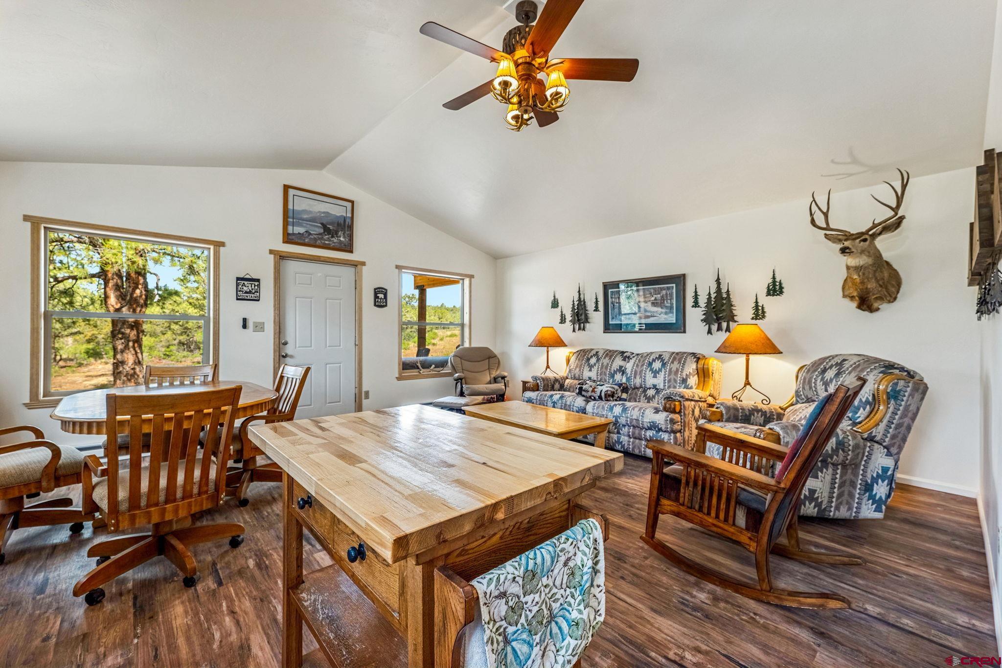 1788 Foxfire Road Bayfield, CO 81122 - Photo 5 of 34 a view of a dining room with furniture window and wooden floor