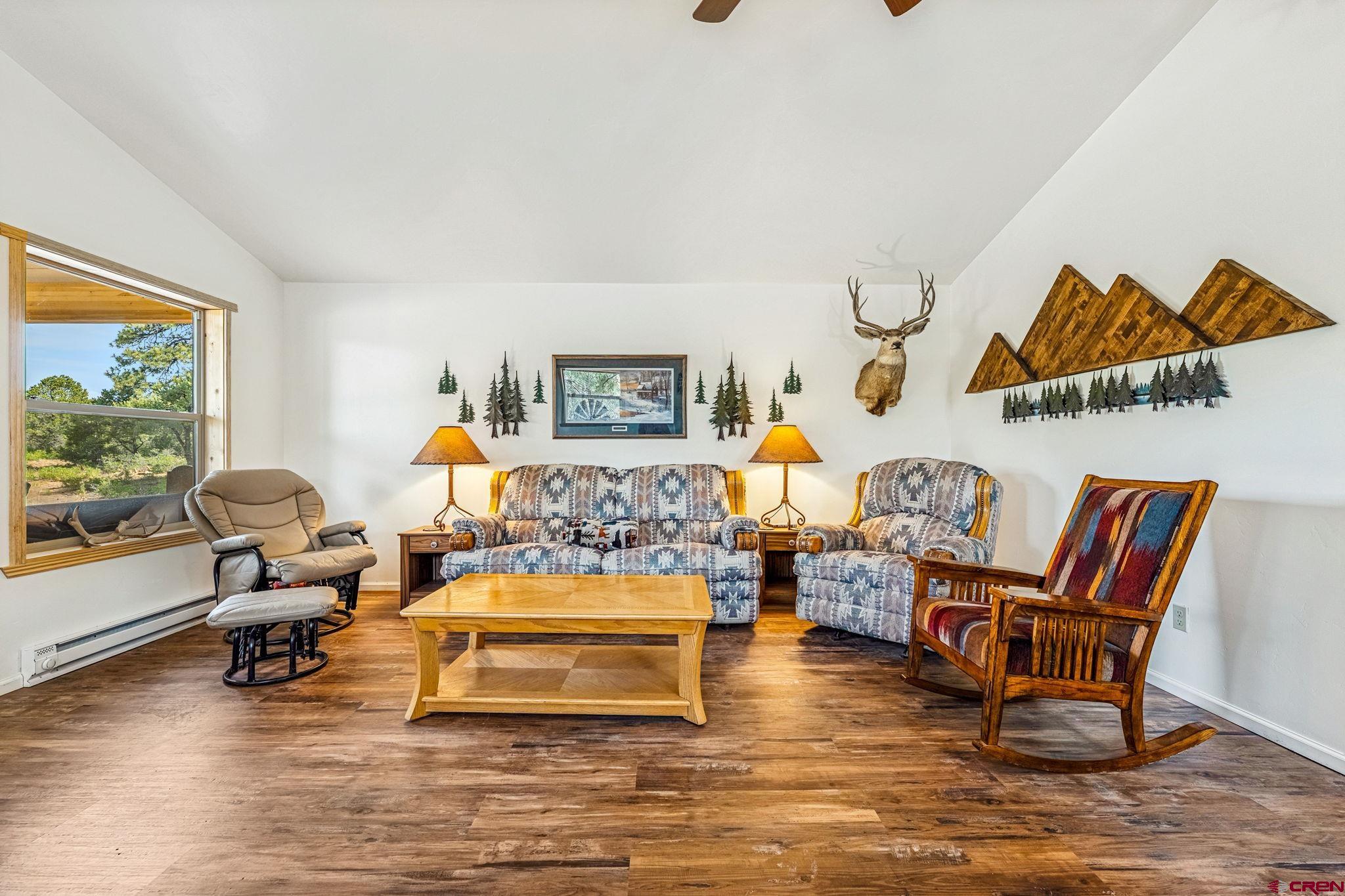 1788 Foxfire Road Bayfield, CO 81122 - Photo 8 of 34 a living room with furniture and a wooden floor