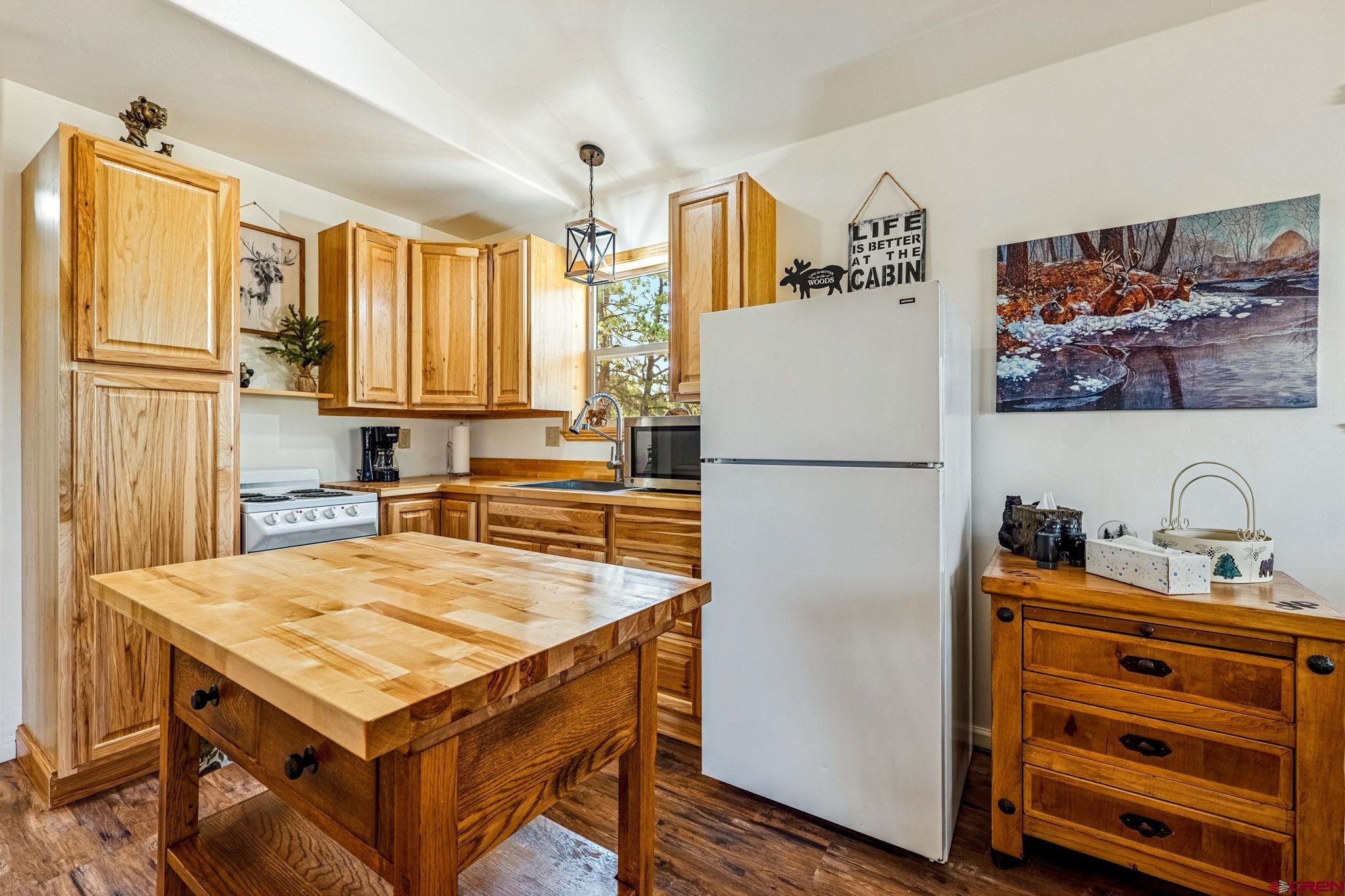 1788 Foxfire Road Bayfield, CO 81122 - Photo 9 of 34 a kitchen with a refrigerator a stove and a refrigerator