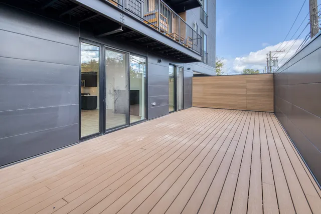 a view of backyard with sitting area
