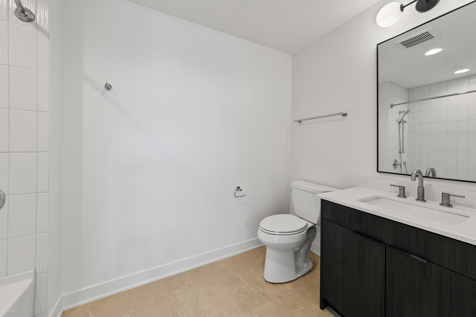1801 West Grand Avenue, Unit 202 Chicago, IL 60622 - Photo 7 of 18 a bathroom with a sink and a toilet