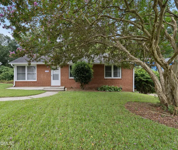 a house view with a garden space