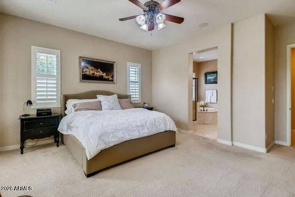 a bathroom with a tub a sink and glass door