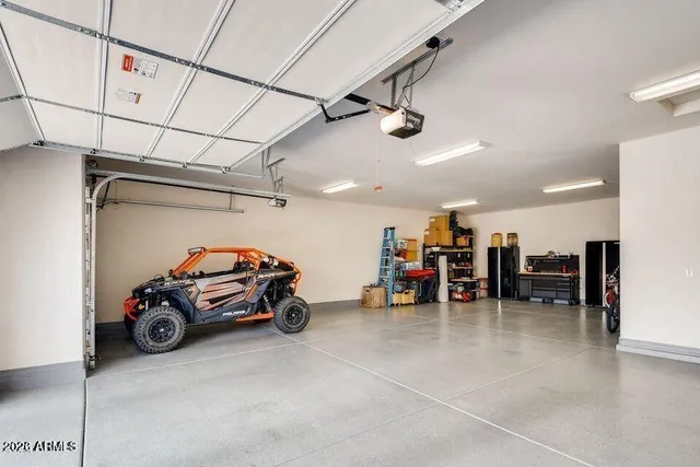 a front view of a house with a garden and yard