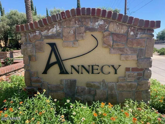 a front view of house with a garden