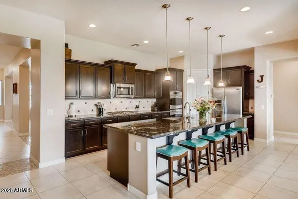 a kitchen with counter top space cabinets and stainless steel appliances