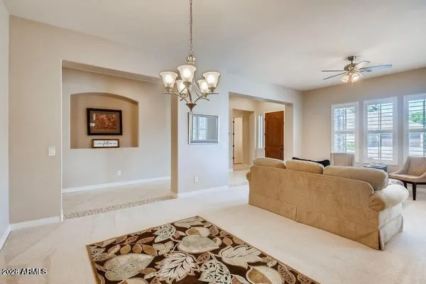 a living room with furniture and windows