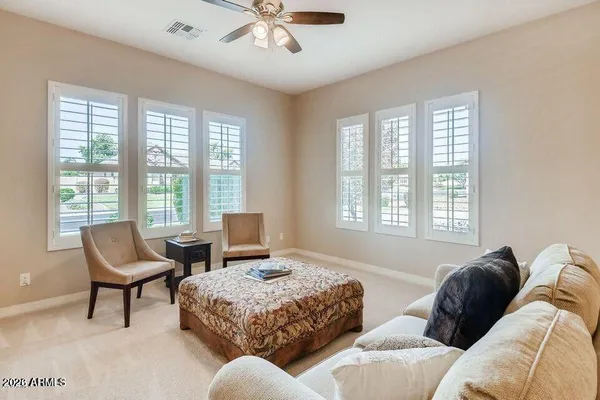 a spacious bedroom with a bed and a couch