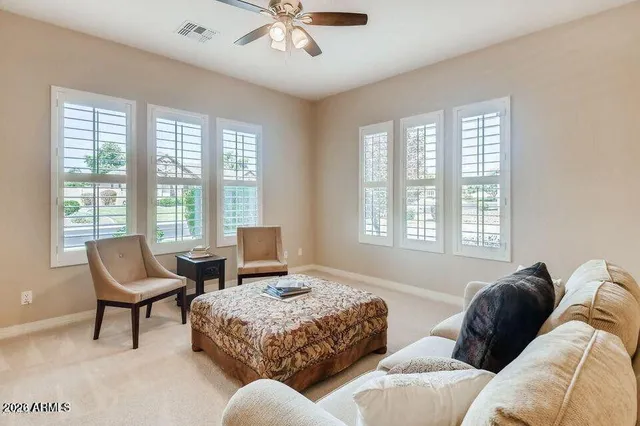 a spacious bedroom with a bed and a couch