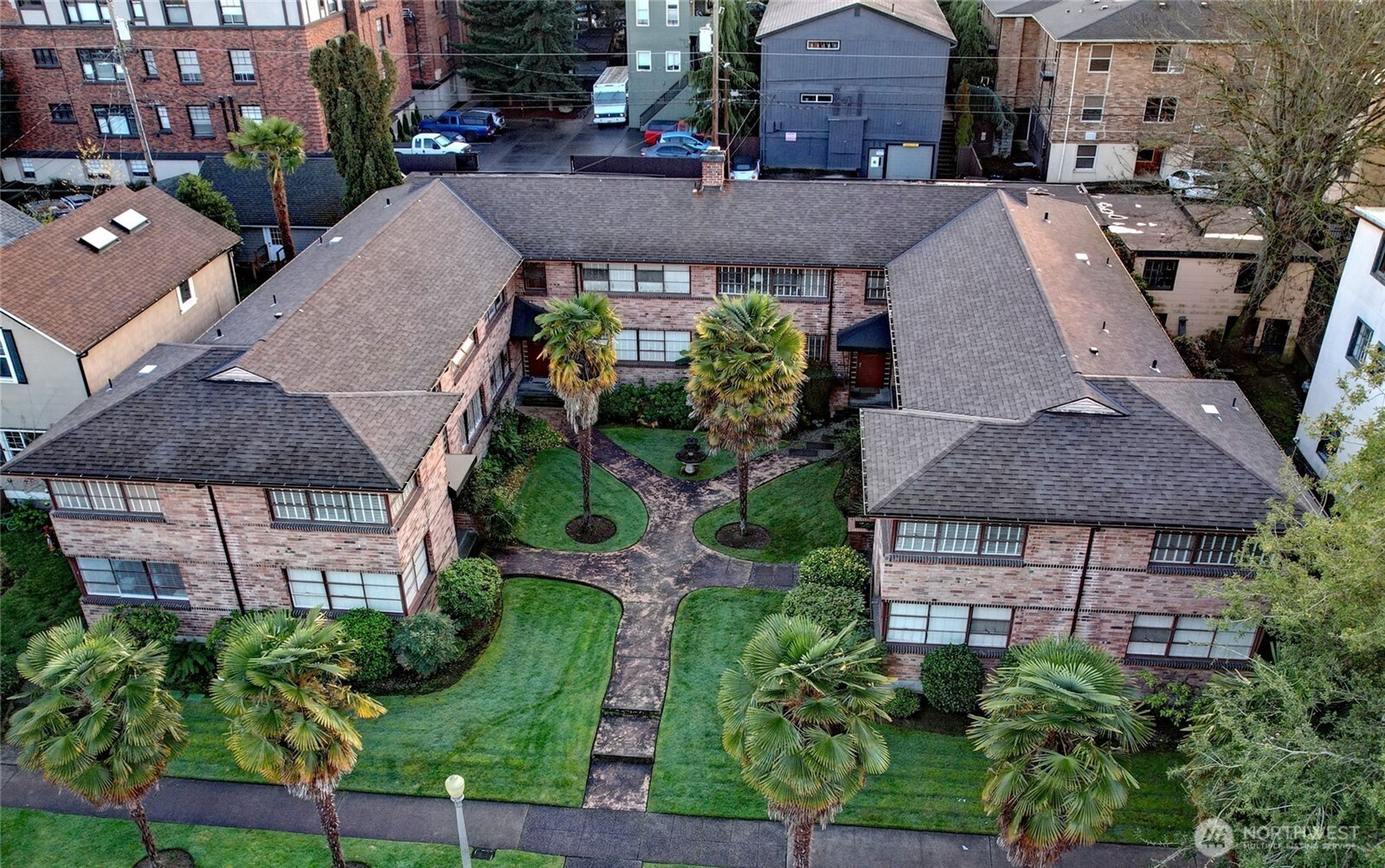 314 North G Street, Unit D2 Tacoma, WA 98403 - Photo 1 of 23 an aerial view of a house with a yard and potted plants