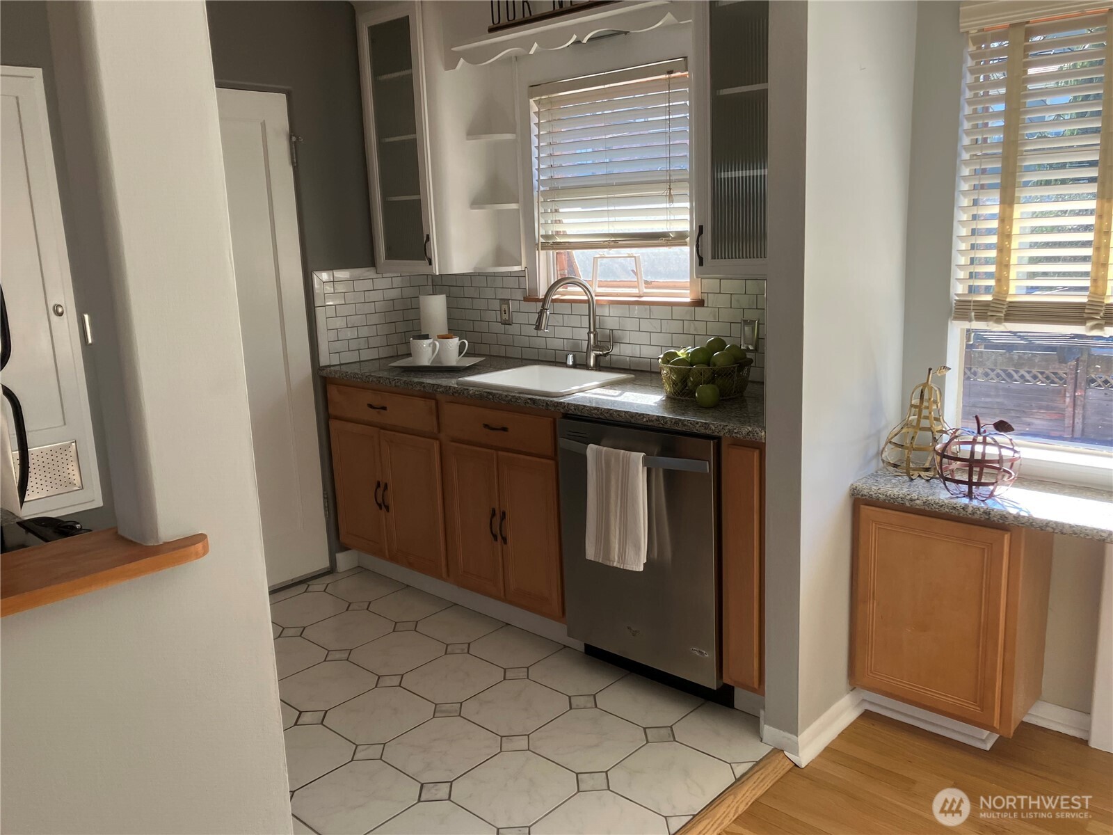 314 North G Street, Unit D2 Tacoma, WA 98403 - Photo 14 of 23 a kitchen with stainless steel appliances granite countertop a sink stove and a refrigerator