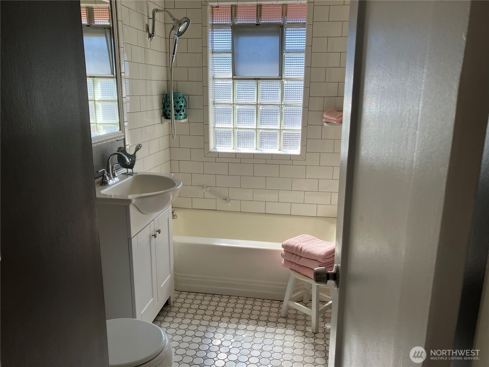 314 North G Street, Unit D2 Tacoma, WA 98403 - Photo 17 of 23 a bathroom with a sink toilet and shower