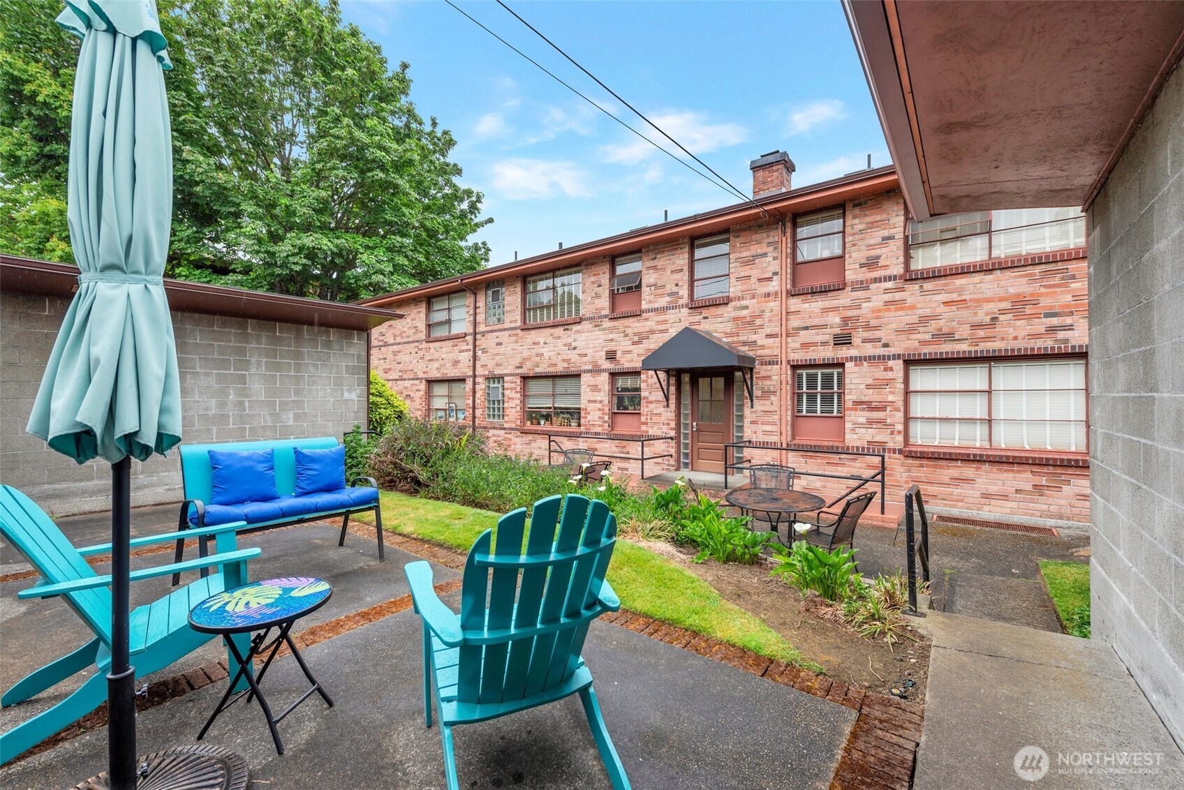 314 North G Street, Unit D2 Tacoma, WA 98403 - Photo 2 of 23 a front view of a house with garden and porch