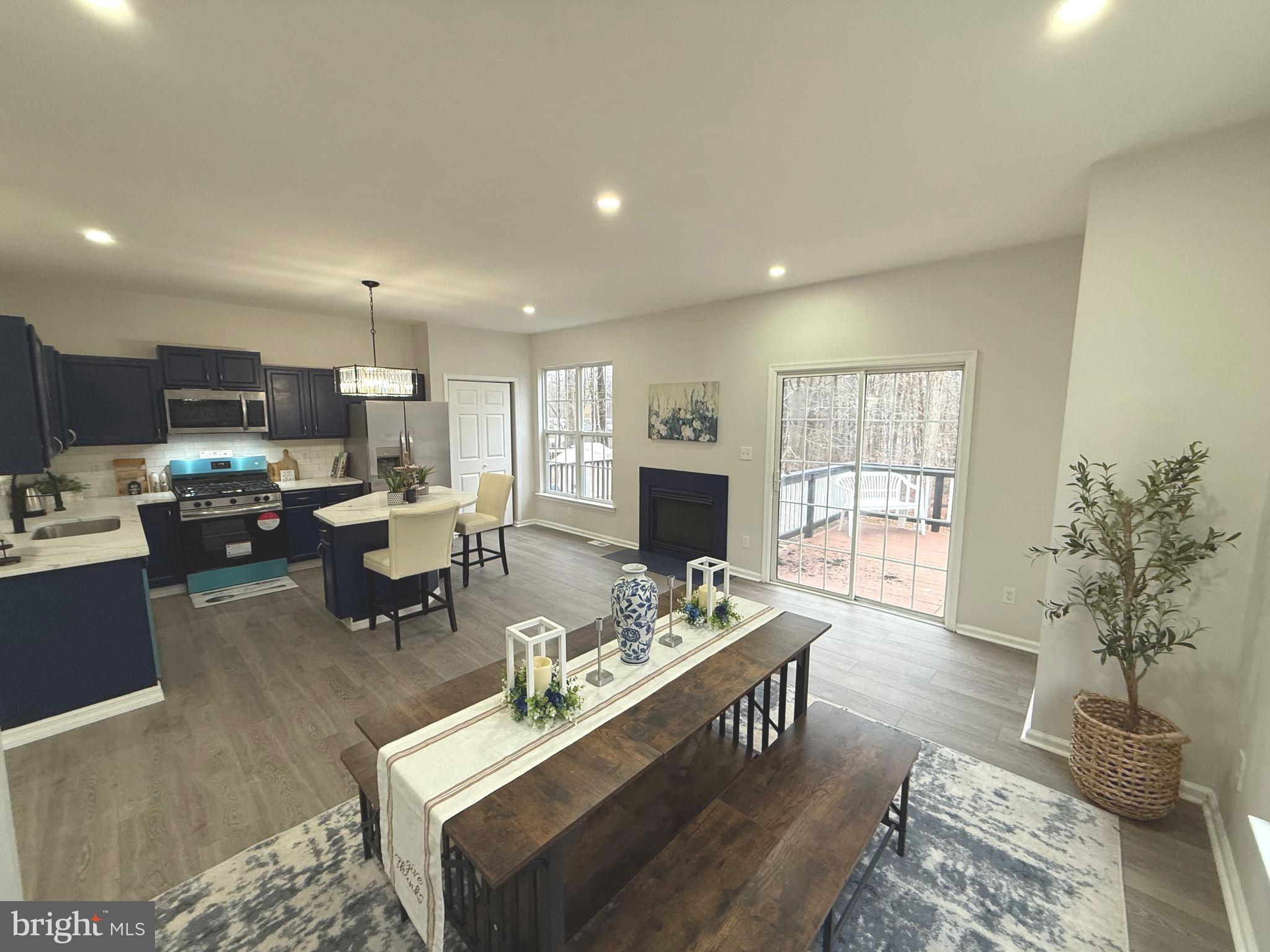 247 Becks Woods Drive Bear, DE 19701 - Photo 11 of 58 a living room with fireplace furniture and a window