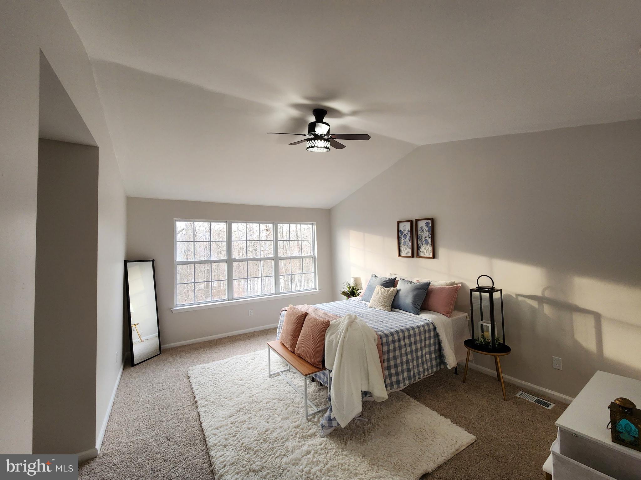 247 Becks Woods Drive Bear, DE 19701 - Photo 23 of 58 a spacious bedroom with a bed and a window