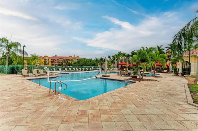 a view of outdoor space with swimming pool and seating