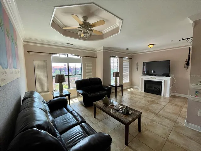 a living room with furniture a rug and a fireplace