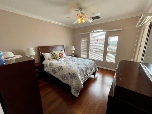 a bedroom with bed and window