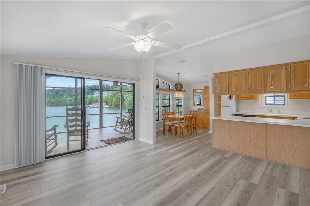 1230 Melton Road, Unit 25 West Union, SC 29696 - Photo 46 of 46 The open floorplan seamlessly connects interior living to a screened porch overlooking tranquil waterfront views.