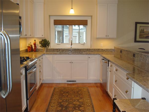 a kitchen with a sink stove and refrigerator
