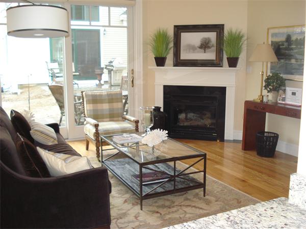 34 Courtyard Place, Unit B Lexington, MA 02420 - Photo 5 of 19 a living room with furniture a table and a fireplace