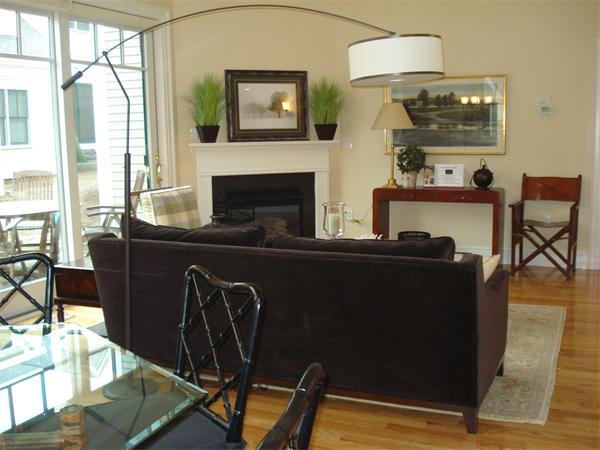 34 Courtyard Place, Unit B Lexington, MA 02420 - Photo 8 of 19 a living room with furniture a flat screen tv and a fireplace