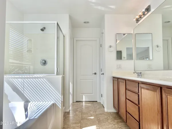 a bathroom with a bathtub and a window