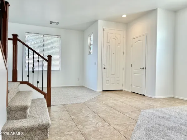 wooden floor in a hall with a window