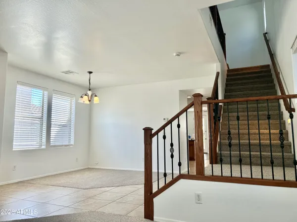 a kitchen with stainless steel appliances a refrigerator a stove a microwave and a sink