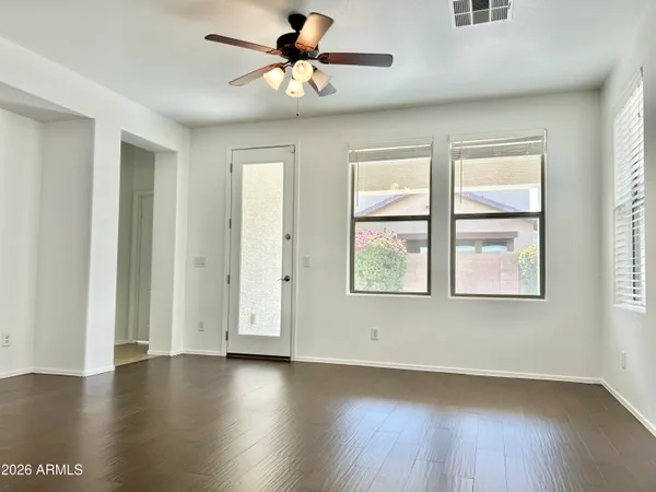 a view of a kitchen with a sink and a refrigerator