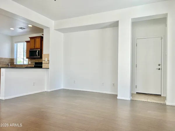 an empty room with windows and closet