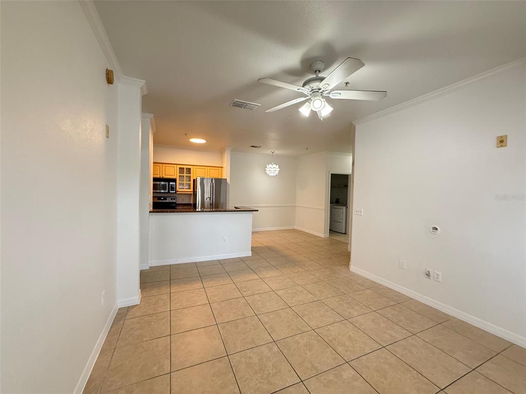 3611 Conroy Road, Unit 825 Orlando, FL 32839 - Photo 6 of 27 a view of a kitchen with a sink and a window