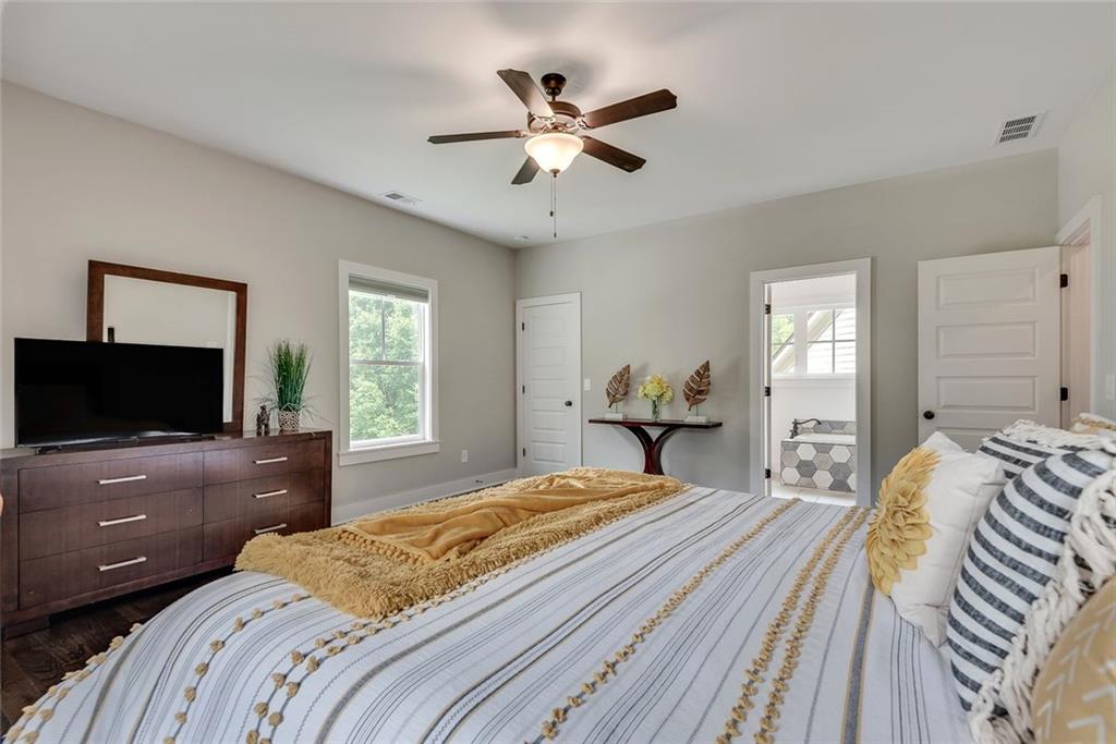 2503 Sugar Pike Road Canton, GA 30115 - Photo 108 of 134 a bedroom with a bed and a flat screen tv