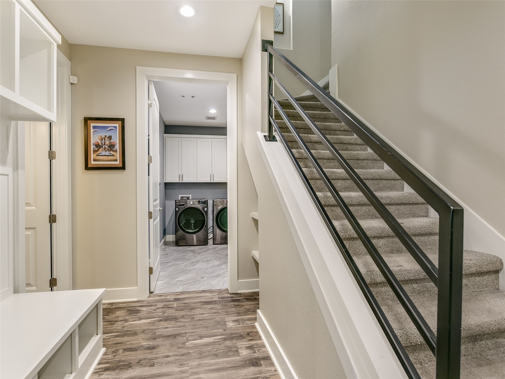 19819 Lockwood Road Manor, TX 78653 - Photo 17 of 29 This transitional hallway blends function with form, leading to the home’s hidden gems like the upstairs guest suite and designer laundry room.