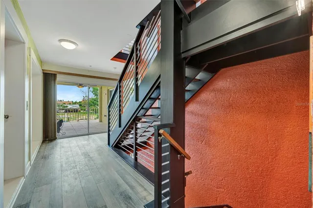 a kitchen with stainless steel appliances kitchen island granite countertop a refrigerator and a stove top oven