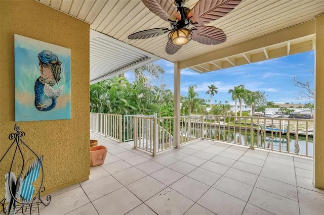 a kitchen with stainless steel appliances granite countertop a sink a refrigerator and a granite counter tops