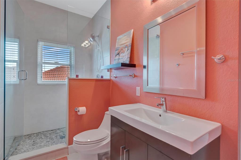614 Norton Street Longboat Key, FL 34228 - Photo 19 of 71 a bathroom with a sink a toilet and a mirror