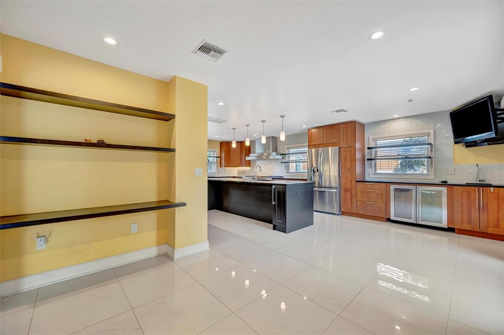 614 Norton Street Longboat Key, FL 34228 - Photo 21 of 71 a kitchen with stainless steel appliances a refrigerator and a sink