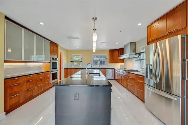 a living room with furniture and a ceiling fan
